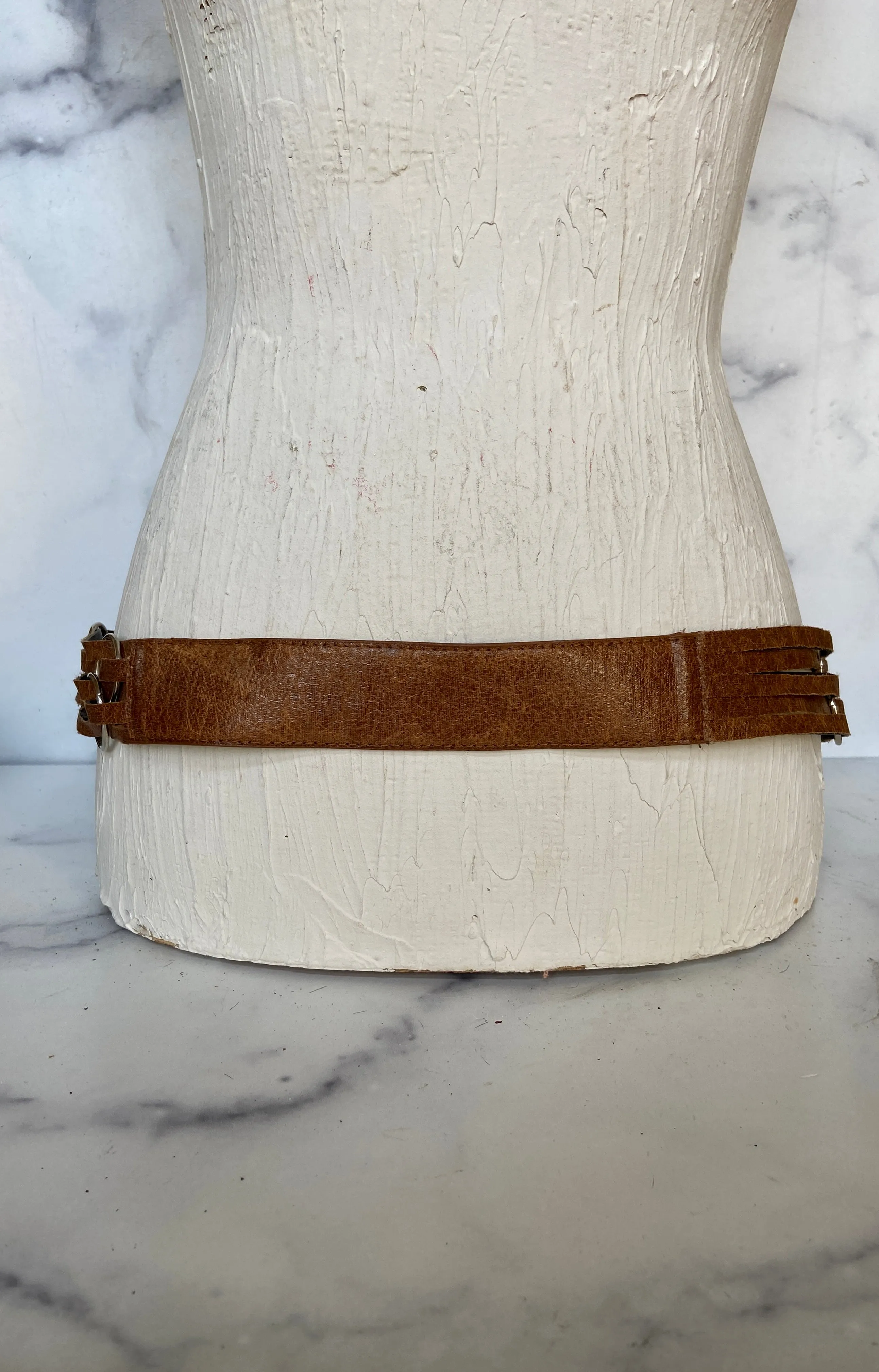 Brown leather belt with metal circle