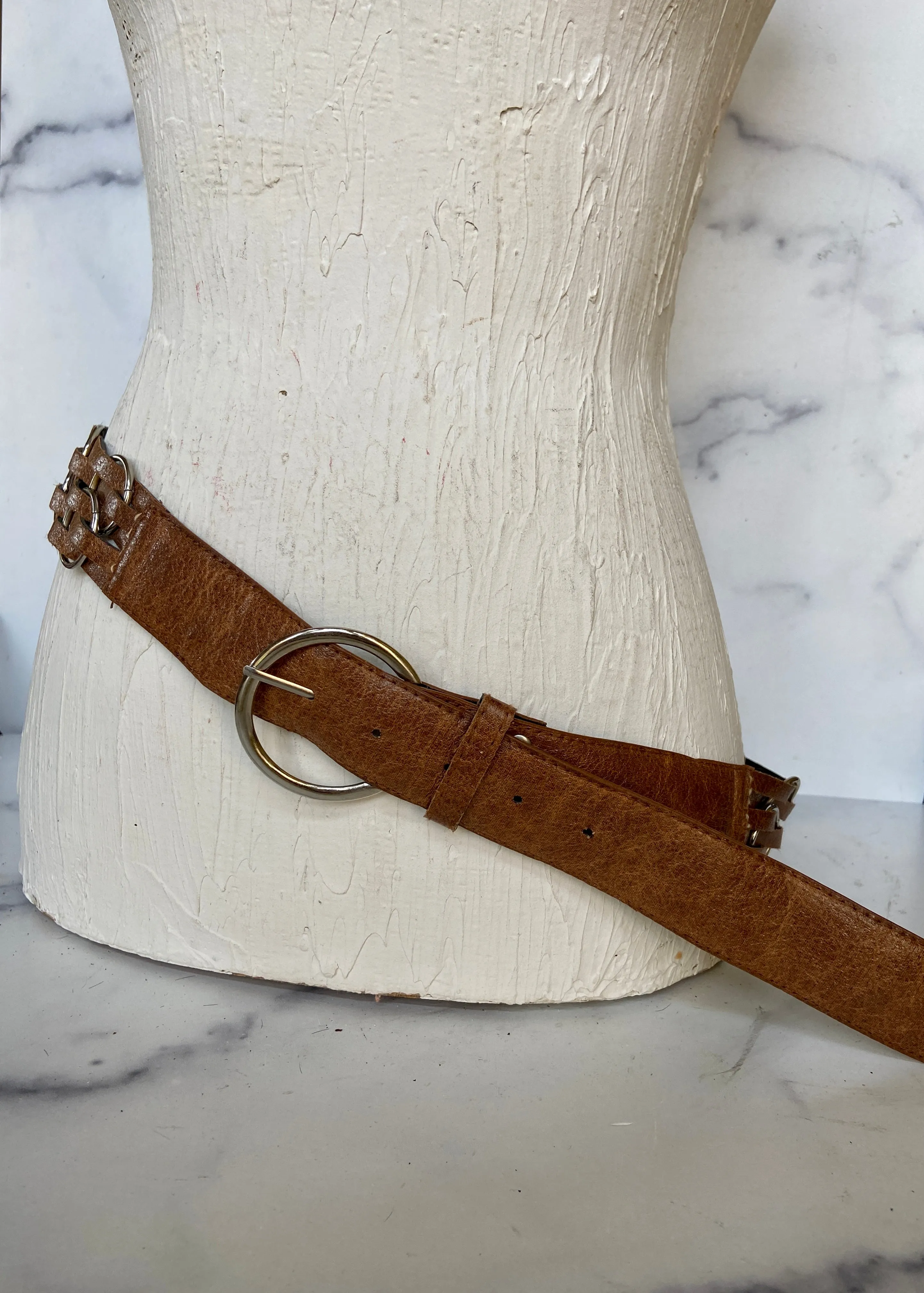 Brown leather belt with metal circle